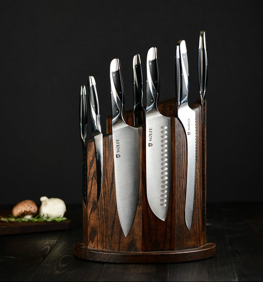 Set of knives in a wooden block on a dark background